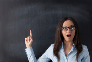 Happy young woman pointing